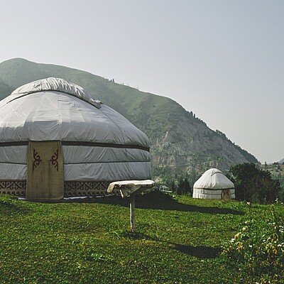 Yurts on the top of the mountain, summer green landscape in Kazakhstan Almaty, nature of Zailiysky Alatau